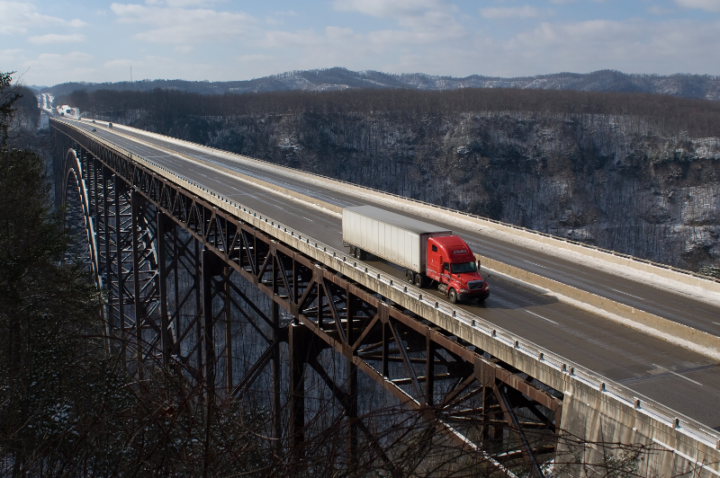 truck crossing the new river gorge bridge